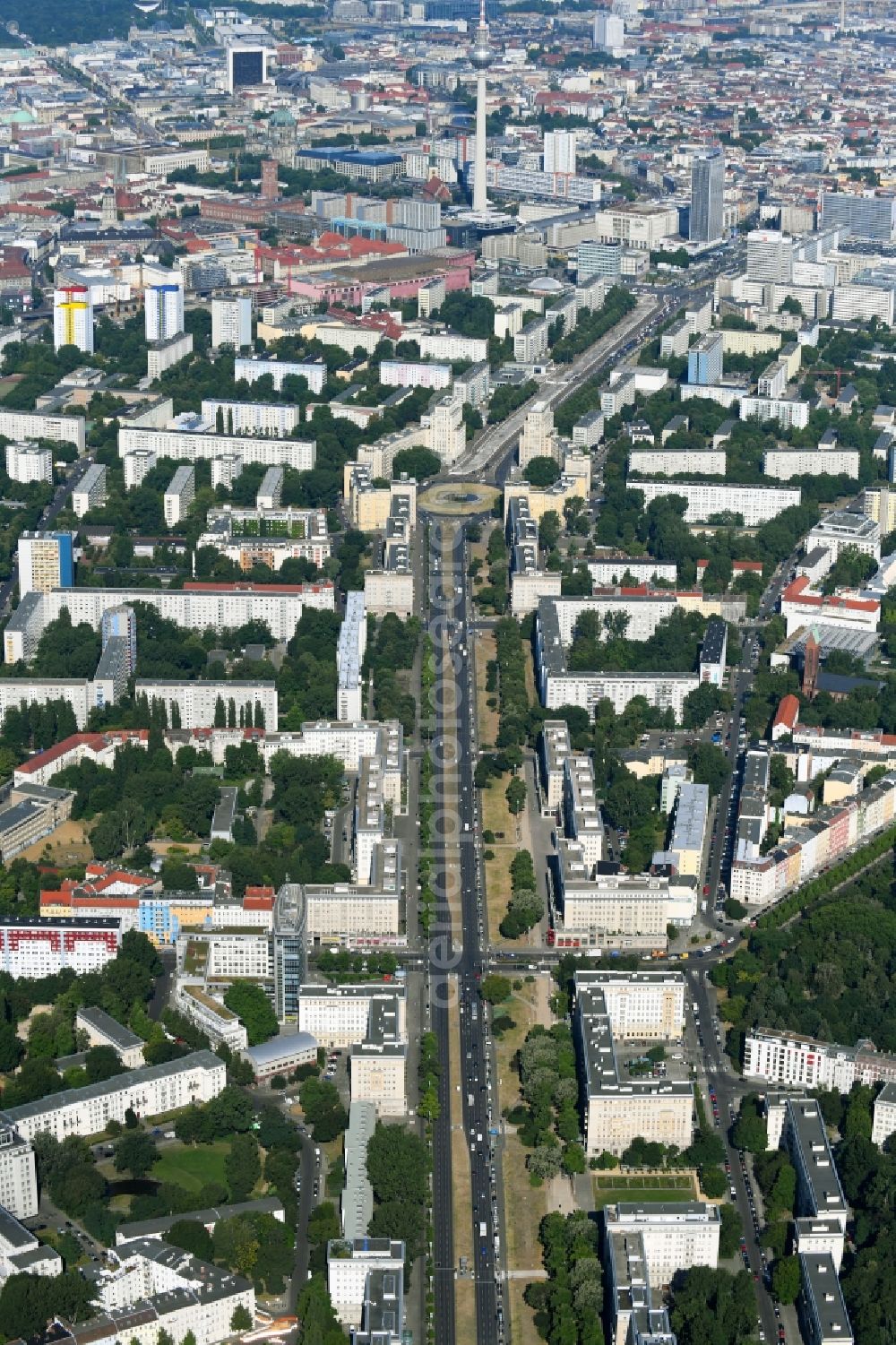 Aerial image Berlin - Street - road guidance of Karl-Marx-Allee - vormals in DDR - Zeiten auch Stalinallee genannt - zum Strausberger Platz in the district Friedrichshain-Kreuzberg in Berlin, Germany