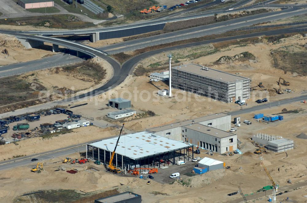 Schönefeld from the bird's eye view: Blick auf die Baustelle der neuen Straßenführung / Anbindung zum Flughafen Berlin-Schönefeld BBI (SXF) im Nordosten des Flughafengelände, bei Kienberg. Ausführende Firmen: Hochtief AG; EUROVIA Beton; PORR; BERGER Bau; Kark Weiss; Matthai; Schäler Bau Berlin GmbH; STRABAG; MAX BÖGL