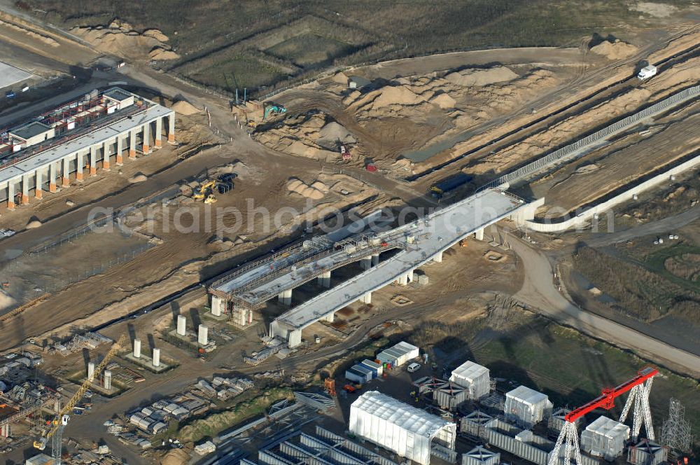 Schönefeld from the bird's eye view: Blick auf die Baustelle der neuen Straßenführung / Anbindung zum Flughafen Berlin-Schönefeld BBI (SXF) im Nordosten des Flughafengelände, bei Kienberg. Ausführende Firmen: Hochtief AG; EUROVIA Beton; PORR; BERGER Bau; Kark Weiss; Matthai; Schäler Bau Berlin GmbH; STRABAG; MAX BÖGL