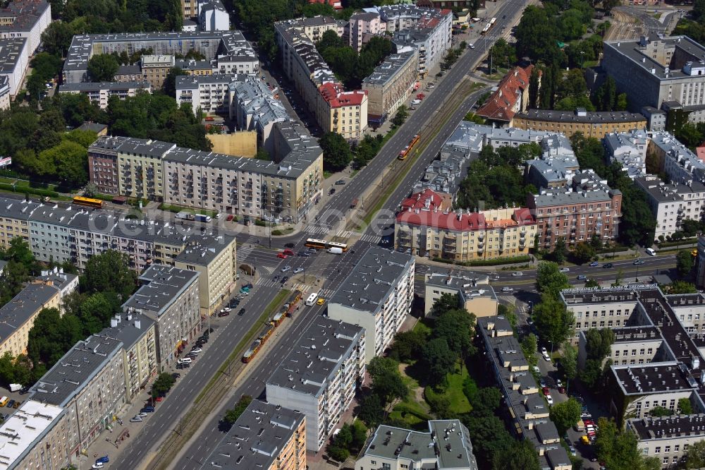 Warschau from above - Street junction in the Ochota district in Warsaw in Poland. The junction is an important traffic interchange of public transport in the North of the district. It is here that the streets Wawelska from the East, Kopiriska from the West and the North-South running Grojecka meet. The tram runs on a separate railway with different lines