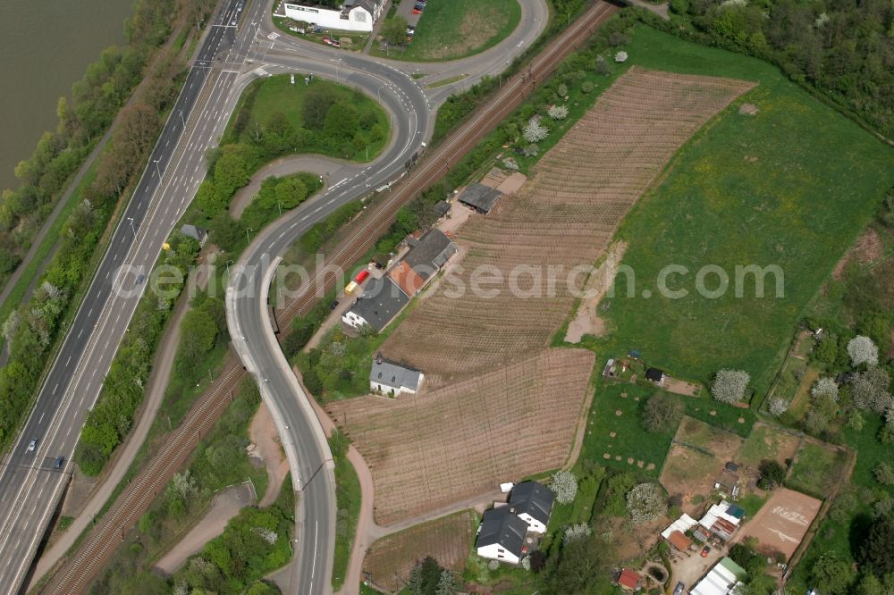 Trier from above - Road, fields and farms in the Feyen district of Trier in the state of Rhineland-Palatinate. Feyen-Weismark is one of 19 districts of Trier and is located in its south. The district is still characterised by viniculture and agriculture and is located on the Eastern riverbank of the Mosel river. It is crossed by the federal road 268