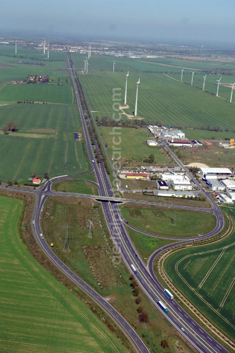 Aerial photograph NAUEN - Blick auf den Strassenverlauf der B273 Ortsumgehung Nauen. Sie unterliegt dem Zuständigkeitsbereich Landesbetrieb Straßenwesen Niederlassung West Hauptsitz Potsdam, Steinstraße 104-106, 14480 Potsdam, Tel. +49(0)331 2334-0, Fax +49(0)331 2334-282, E-Mail: p.poststellels@ls.brandenburg.de; Die Projektsteuerung erfolgt durch Schüßler Plan Ingenieurgesellschaft mbH, Greifswalder Straße 80 A, 10405 Berlin, Tel. +49(0)30 42106 0, E-Mail: berlin@schuessler-plan.de