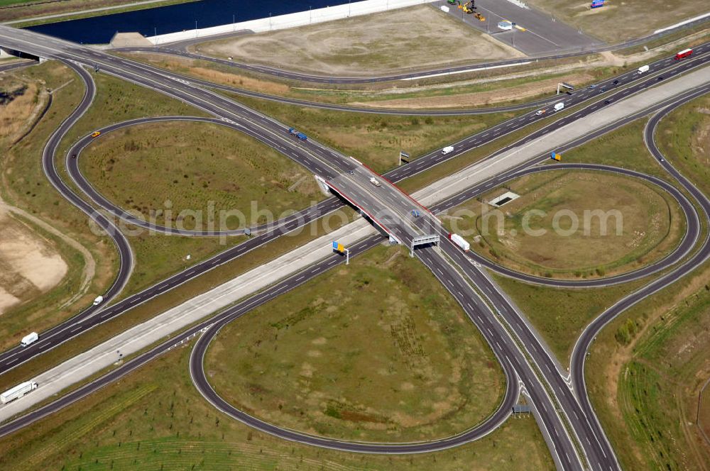 Aerial photograph WUSTERMARK - Blick auf den Strassenverlauf der B5 Ortsumgehung Wustermark. Sie unterliegt dem Zuständigkeitsbereich Landesbetrieb Straßenwesen Niederlassung West Hauptsitz Potsdam, Steinstraße 104-106, 14480 Potsdam, Tel. +49(0)331 2334-0, Fax +49(0)331 2334-282, E-Mail: p.poststellels@ls.brandenburg.de; Die Projektsteuerung erfolgt durch Schüßler Plan Ingenieurgesellschaft mbH, Greifswalder Straße 80 A, 10405 Berlin, Tel. +49(0)30 42106 0, E-Mail: berlin@schuessler-plan.de