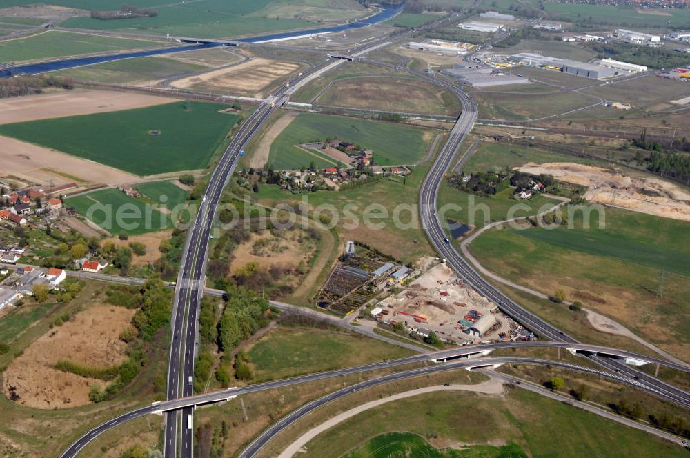 WUSTERMARK from the bird's eye view: Blick auf den Strassenverlauf der B5 Ortsumgehung Wustermark. Sie unterliegt dem Zuständigkeitsbereich Landesbetrieb Straßenwesen Niederlassung West Hauptsitz Potsdam, Steinstraße 104-106, 14480 Potsdam, Tel. +49(0)331 2334-0, Fax +49(0)331 2334-282, E-Mail: p.poststellels@ls.brandenburg.de; Die Projektsteuerung erfolgt durch Schüßler Plan Ingenieurgesellschaft mbH, Greifswalder Straße 80 A, 10405 Berlin, Tel. +49(0)30 42106 0, E-Mail: berlin@schuessler-plan.de