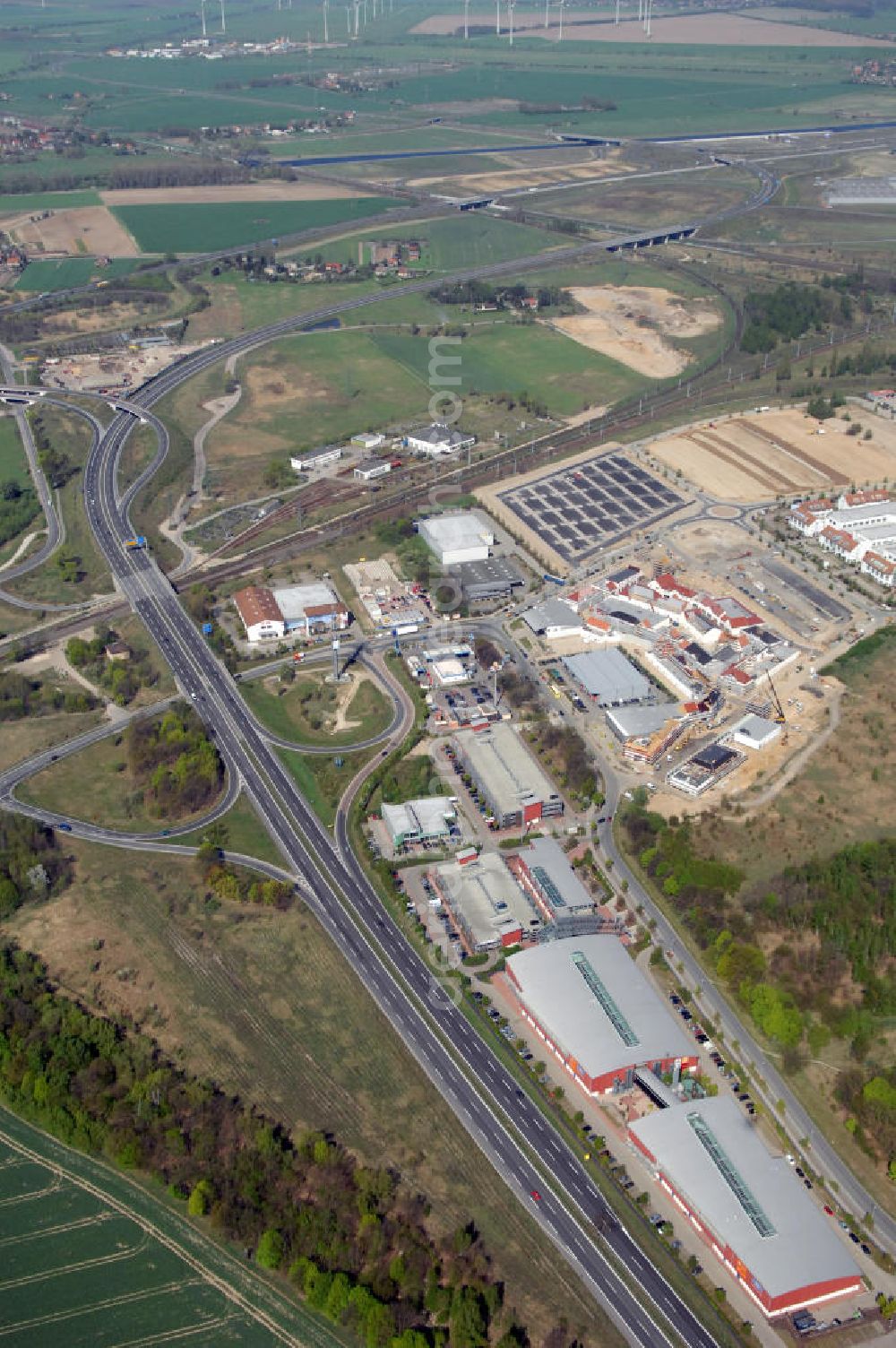 Aerial photograph WUSTERMARK - Blick auf den Strassenverlauf der B5 Ortsumgehung Wustermark. Sie unterliegt dem Zuständigkeitsbereich Landesbetrieb Straßenwesen Niederlassung West Hauptsitz Potsdam, Steinstraße 104-106, 14480 Potsdam, Tel. +49(0)331 2334-0, Fax +49(0)331 2334-282, E-Mail: p.poststellels@ls.brandenburg.de; Die Projektsteuerung erfolgt durch Schüßler Plan Ingenieurgesellschaft mbH, Greifswalder Straße 80 A, 10405 Berlin, Tel. +49(0)30 42106 0, E-Mail: berlin@schuessler-plan.de