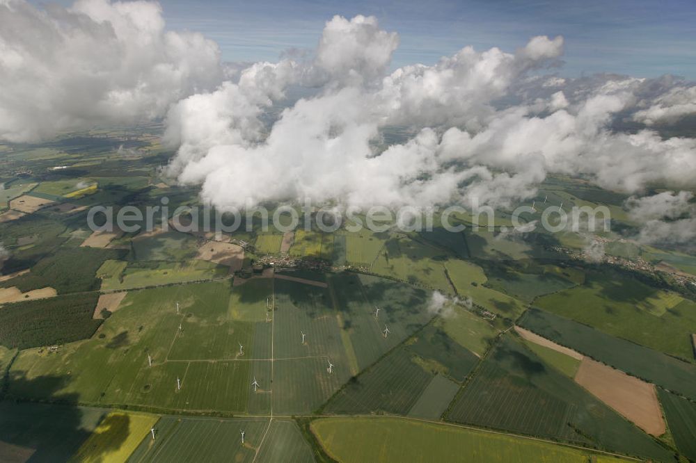 Aerial image Heiligengrabe - Blick auf Strato- und Kumuluswolkenfelder über landwirtschaftlichen Feldern der Ostprignitz im Umfeld von Heiligengrabe. Besonders in den Vormittagsstunden neigt frühsommerliches Wetter oft zu Quellwolkenbildung mit Niederschlag. View of Strato-cumulus clouds over farm fields near Heiligengrabe.