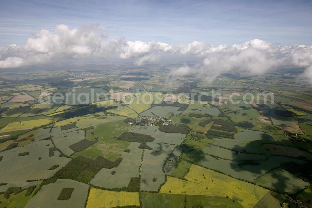 Aerial photograph Heiligengrabe - Blick auf Strato- und Kumuluswolkenfelder über landwirtschaftlichen Feldern der Ostprignitz im Umfeld von Heiligengrabe. Besonders in den Vormittagsstunden neigt frühsommerliches Wetter oft zu Quellwolkenbildung mit Niederschlag. View of Strato-cumulus clouds over farm fields near Heiligengrabe.