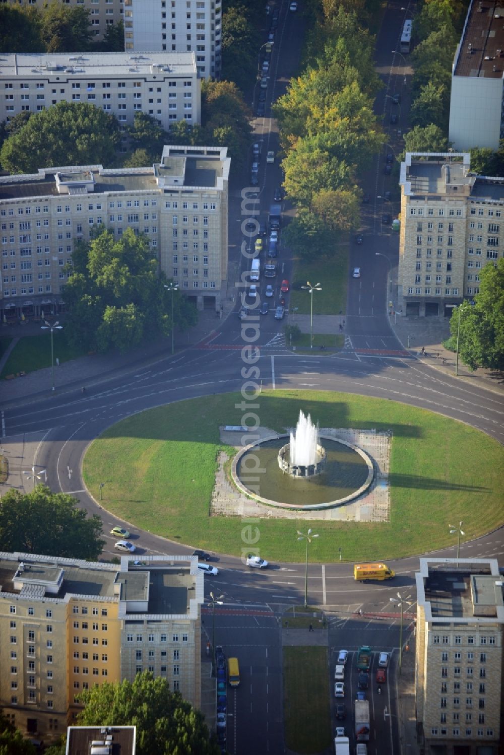 Berlin-Friedrichshain from above - View of the Strausberger Platz with fountain in the district Friedrichshain of Berlin. The Strausberger Platz marks the border to the borough Mitte. The place was arranged 1967 after a fountain, designed by Fritz Kühn, had been constructed