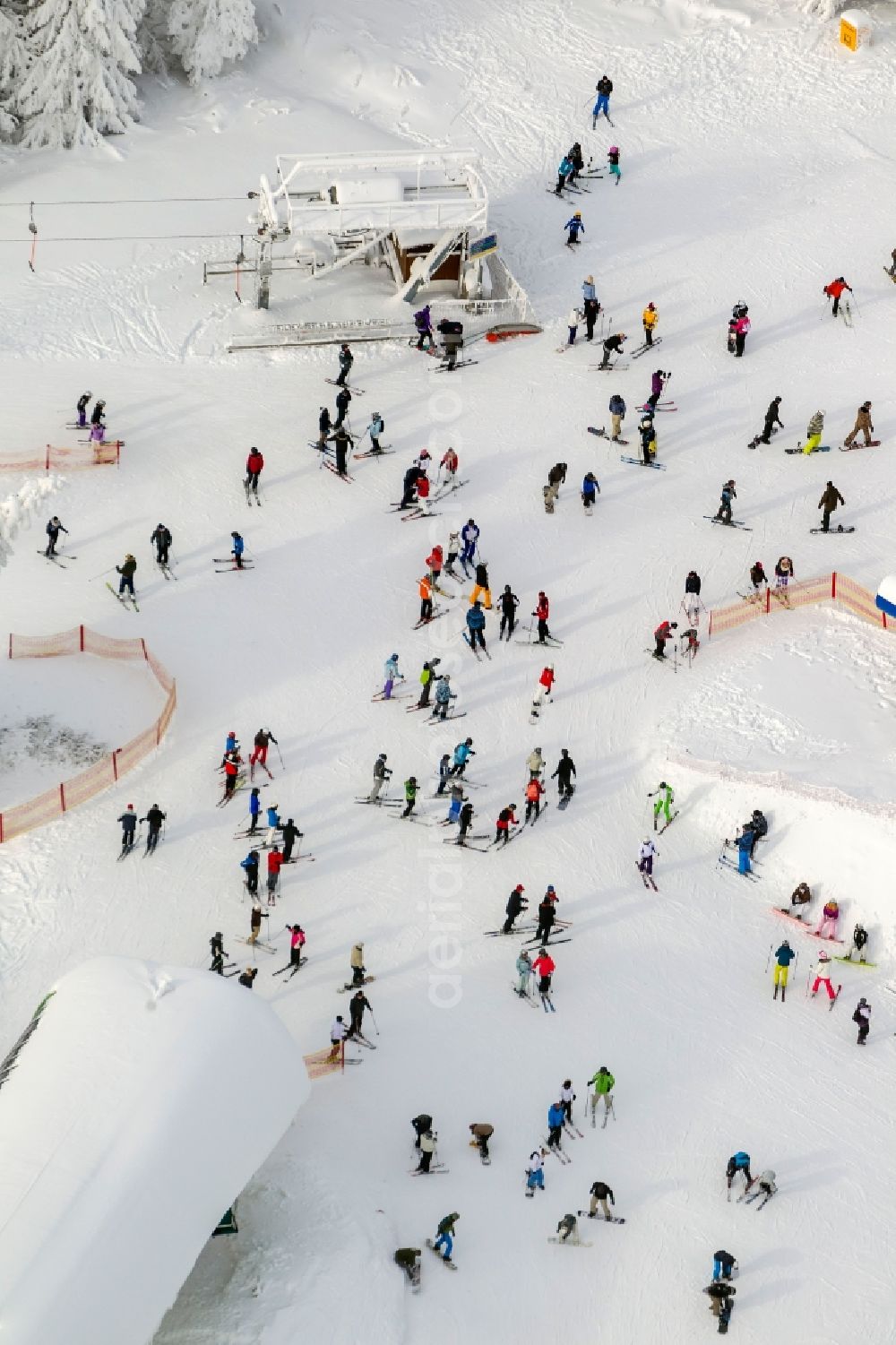 Aerial photograph Winterberg - Winter - view of the snow-line of descent with mountain ski station, ski and sailing in Winterberg in North Rhine-Westphalia NRW