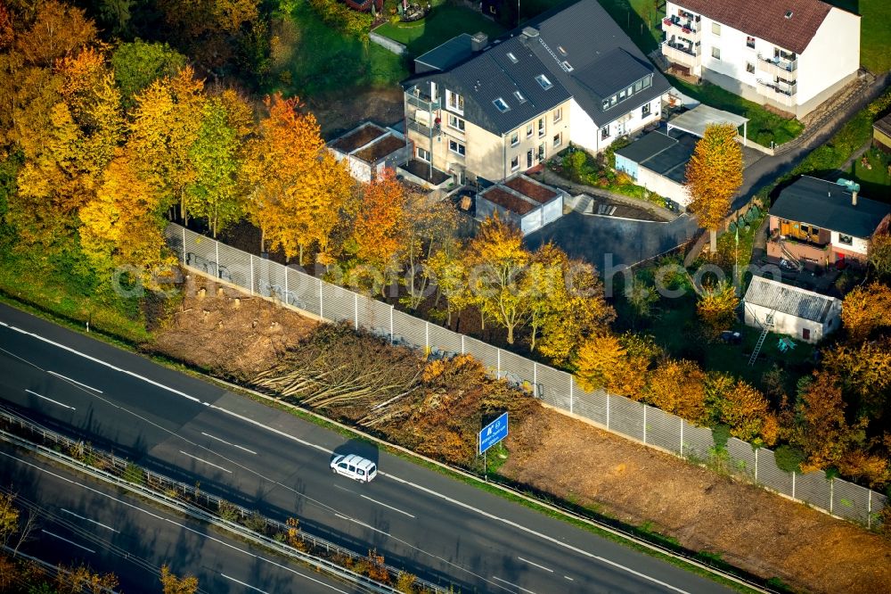 Aerial image Witten - Part of the federal motorway A44 in the area of the exit Witten-Zentrum in Witten in the state of North Rhine-Westphalia. Cut trees are lying next to the road and a fence