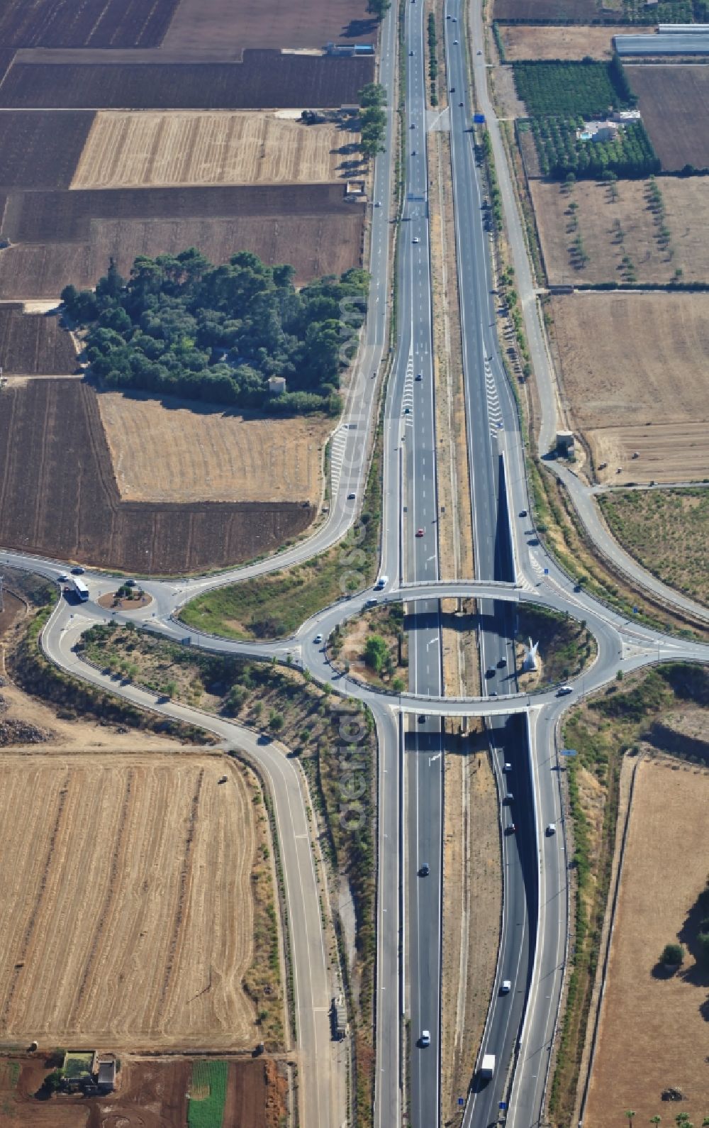 Aerial photograph Inca - Routing and traffic lanes during the highway exit and access of the motorway M-13 in Inca Mallorca in Islas Baleares, Spain