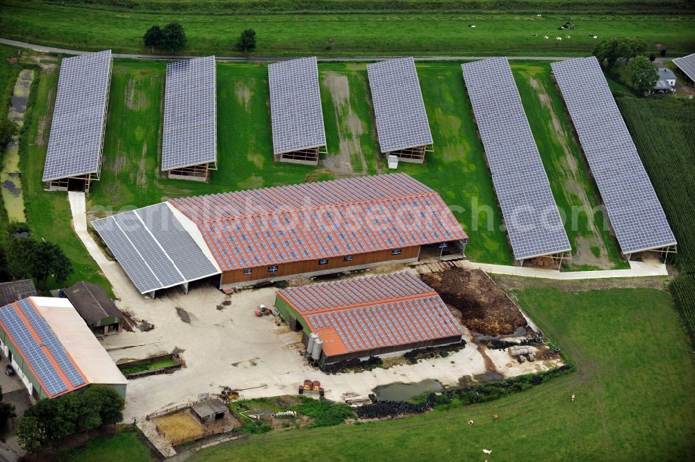 Groven from the bird's eye view: View of an area for round bale storage with photovoltaics in Groven in the state Schleswg-Holstein