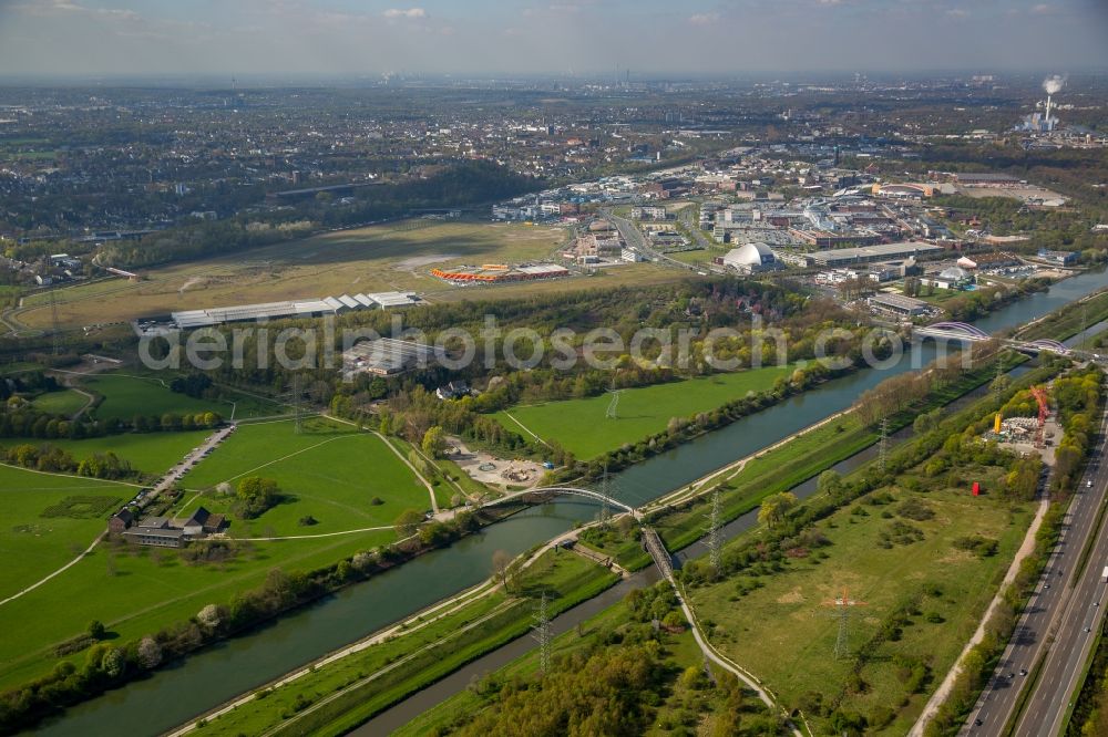 Aerial image Oberhausen - Power tower-construction of a road and Interconnector Steel sculpture sorcerer - dancing electricity pylon in Oberhausen in the state North Rhine-Westphalia