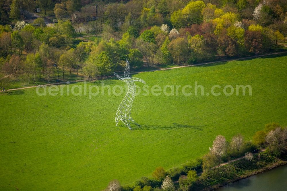 Oberhausen from above - Power tower-construction of a road and Interconnector Steel sculpture sorcerer - dancing electricity pylon in Oberhausen in the state North Rhine-Westphalia