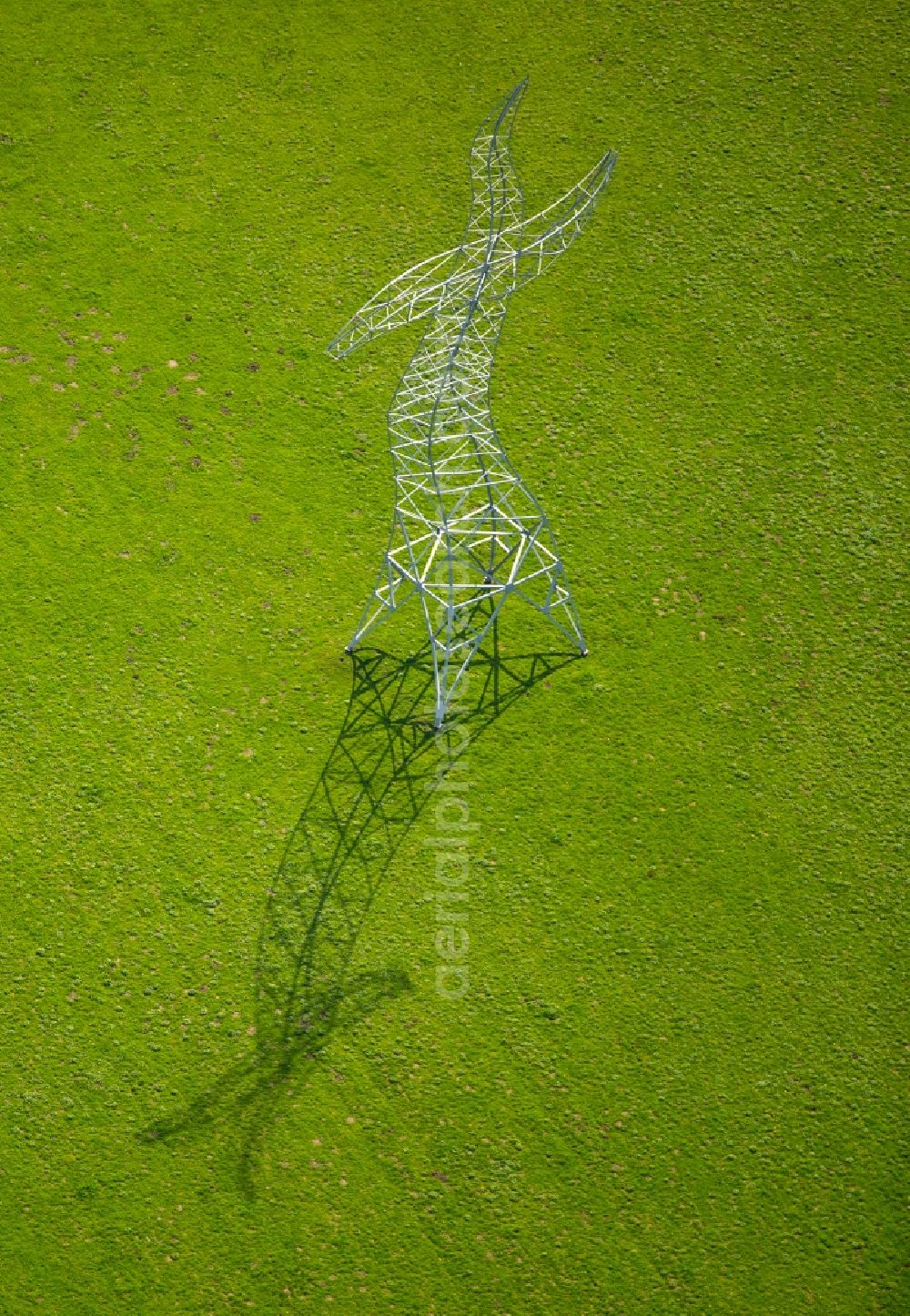 Aerial image Oberhausen - Power tower-construction of a road and Interconnector Steel sculpture sorcerer - dancing electricity pylon in Oberhausen in the state North Rhine-Westphalia