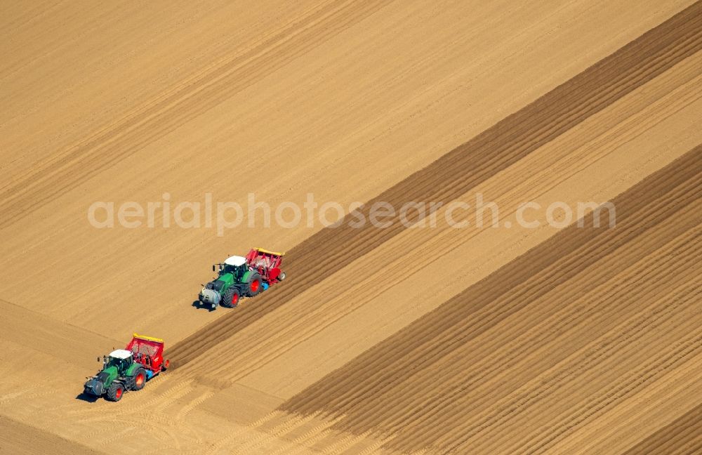 Linnich from above - Structures on harrowing and seeding agricultural fields in Linnich in the state North Rhine-Westphalia