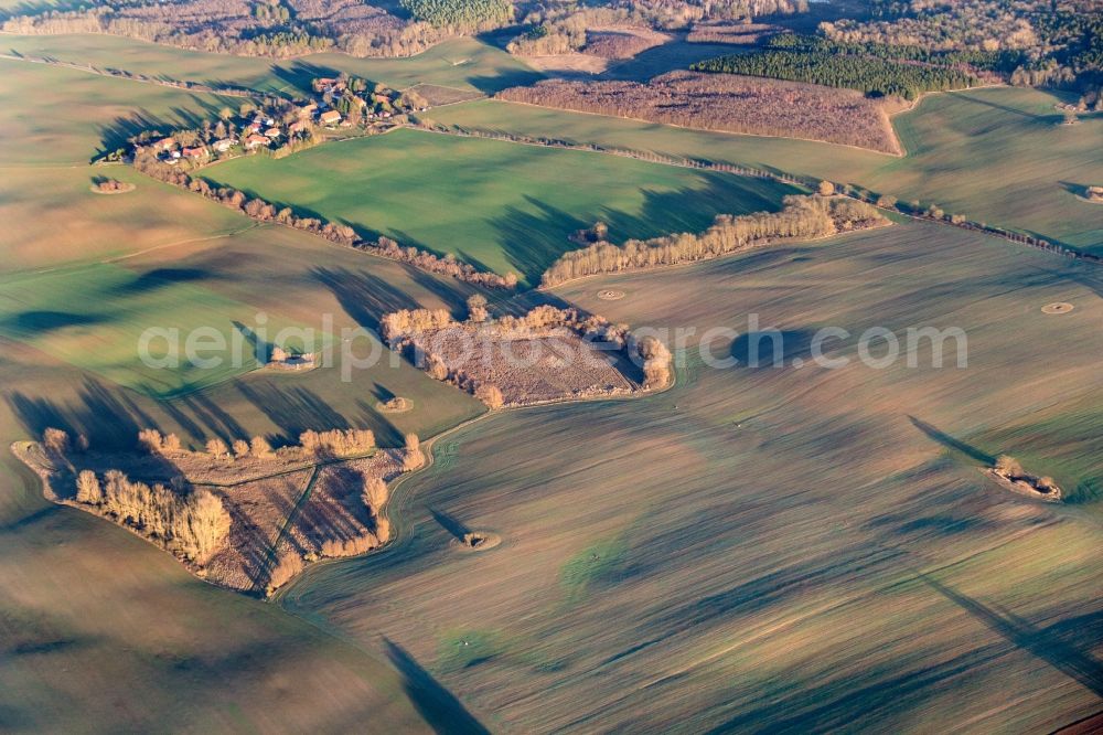Petersdorf from above - Structures on agricultural fields in evening light in Petersdorf in the state Mecklenburg - Western Pomerania, Germany