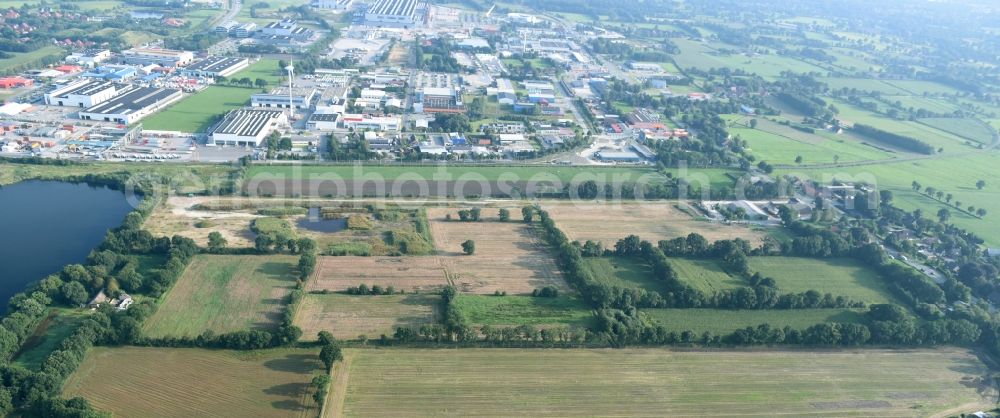 Aurich from the bird's eye view: Structures on agricultural fields near the industrial estate Sandhorst in Aurich in the state Lower Saxony