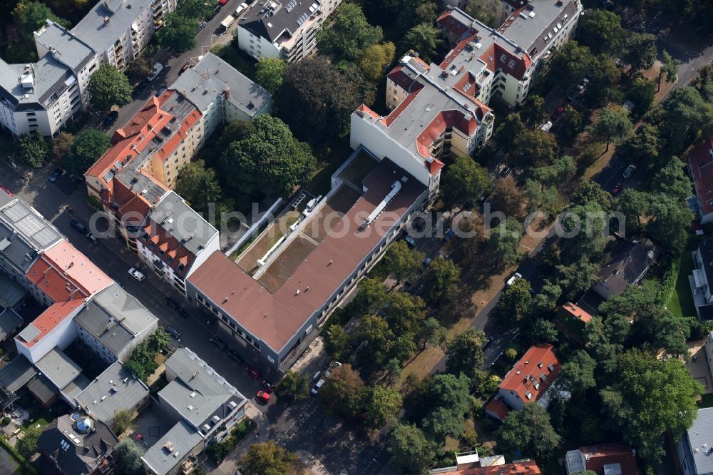 Berlin from above - Store of the Supermarket Aldi in a residential area in the Warnemuender Strasse in Berlin