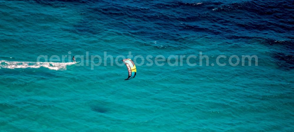 Aerial image Son Serra de Marina - Surfer - kitesurfer in motion in the bay of Alcudia in Son Serra de Marina in Balearic island of Mallorca, Spain