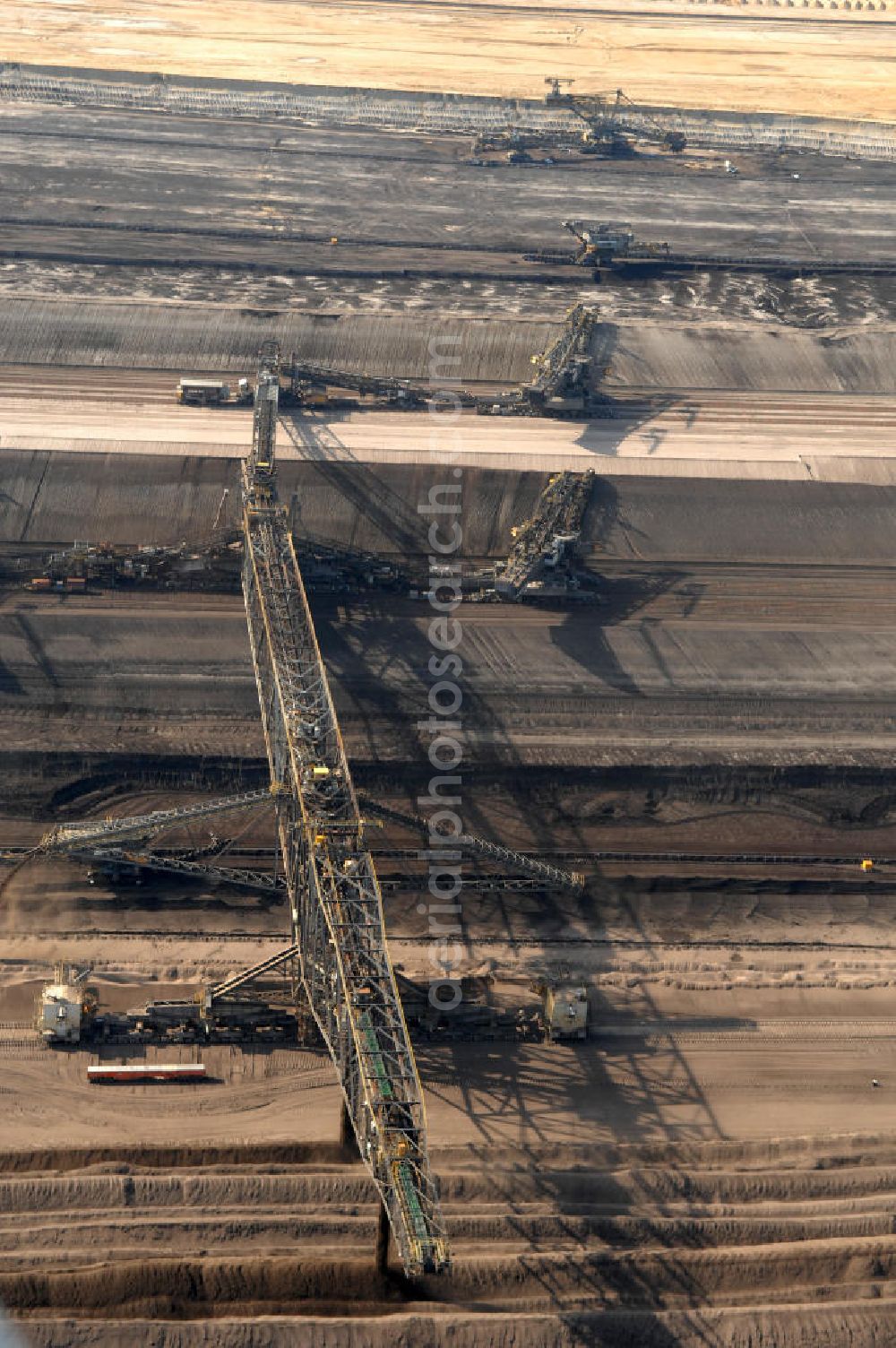 Aerial photograph Nochten - Blick auf den Tagebau Nochten in Sachsen. Der Tagebau Nochten ist ein Braunkohletagebau in der Oberlausitz im Landkreis Görlitz, der von der Vattenfall Europe Mining AG betrieben wird. Der Betreiber Vattenfall Europe Mining ist mit ca. 7000 Beschäftigten der größte Arbeitgeber und Steuerzahler der Lausitz. Kontakt: Vattenfall Europe Mining AG, Tel. +49 0355 2887 3051,