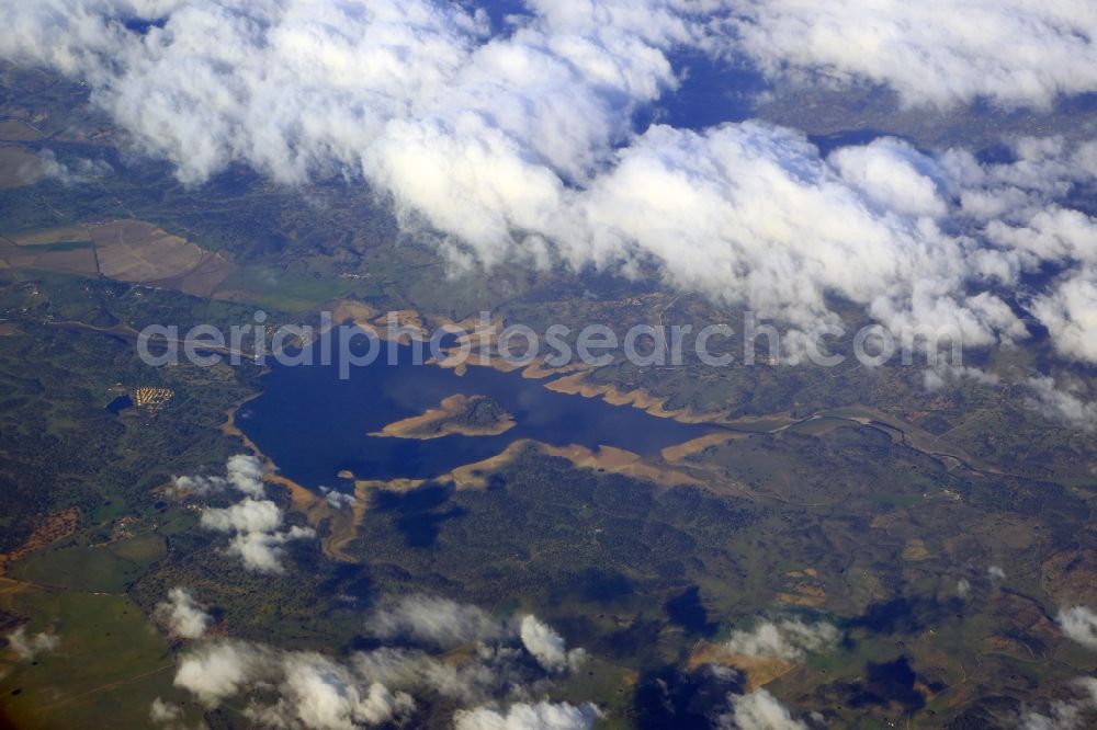 Aerial image Santibanez el Alto - Shore areas at the lake and reservoir Embalse Borbollon in Santibanez el Alto in Extremadura, Spain