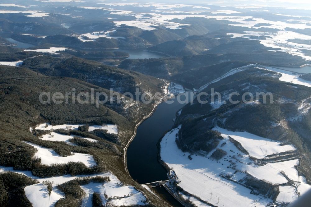 Hohenwarte from above - Dam and shore areas at the lake with wintry snowy village in Hohenwarte in the state Thuringia