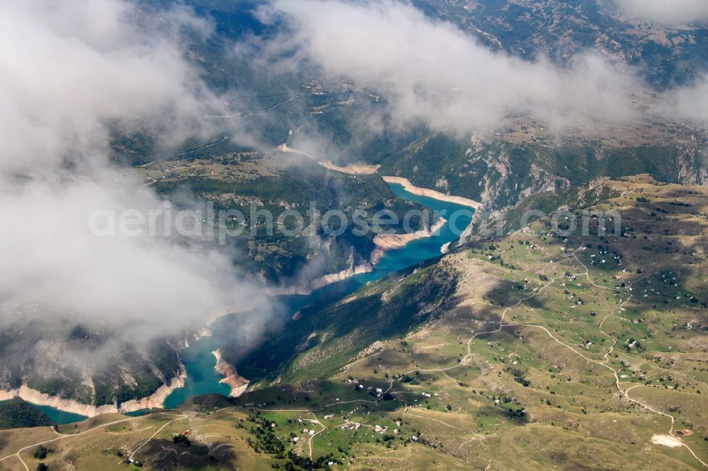 Plužine from the bird's eye view: Dam and shore areas at the lake in Plužine in Montenegro. The Pivsko Lake is a reservoir in northwestern of Montenegro and is the largest dam in the country. The reservoir flooded the original site of the Piva monastery