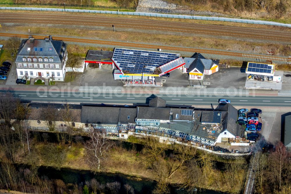 Nuttlar from above - Gas station for sale of petrol and diesel fuels and mineral oil trade Esso on street Briloner Strasse in Nuttlar at Sauerland in the state North Rhine-Westphalia, Germany