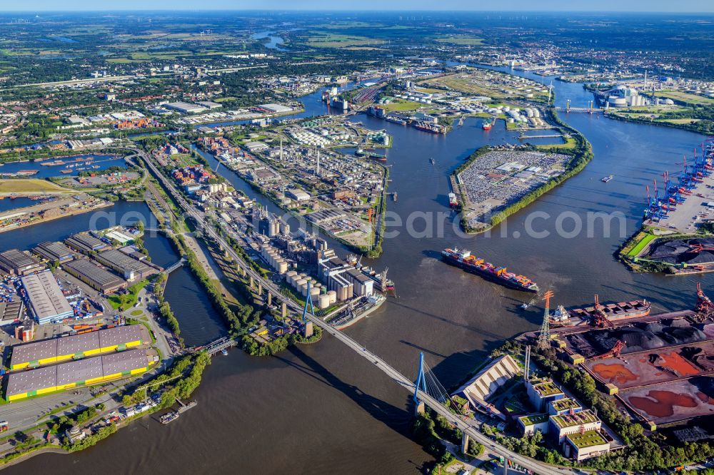 Aerial image Hamburg - Equipment in the industrial area and der Rethe - Elbe Muendung entlang des Verlaufs der Strasse Koehlbrandbruecke mit dem gleichnamigen Brueckenbauwerk in Hamburg in Germany