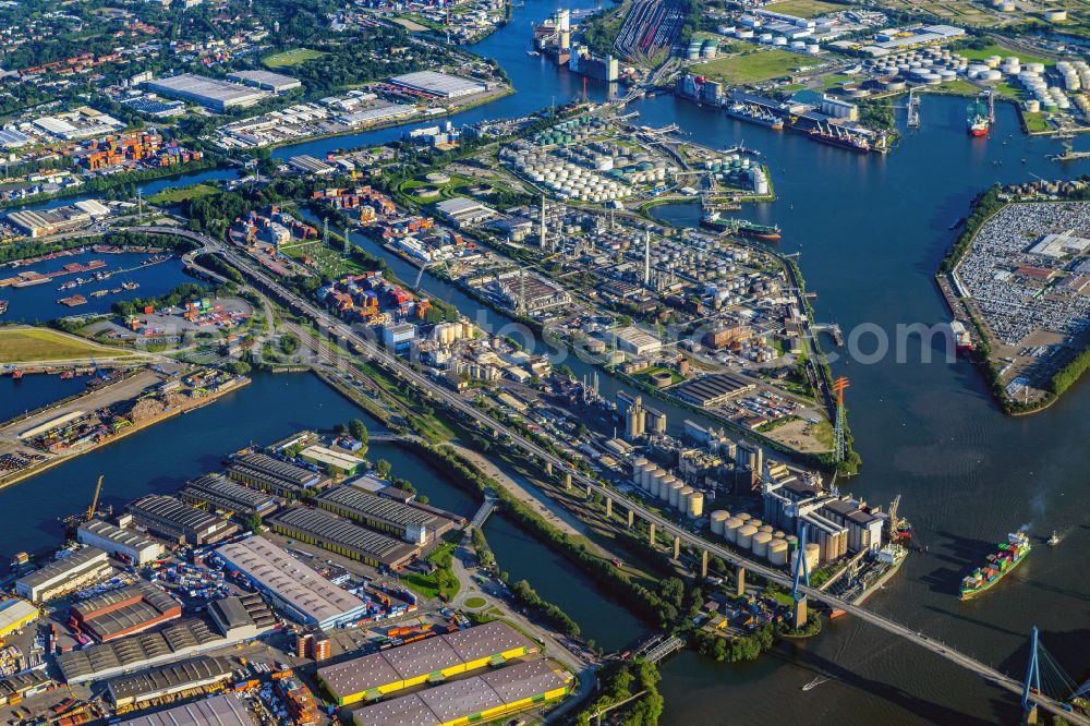 Aerial image Hamburg - Equipment in the industrial area and der Rethe - Elbe Muendung entlang des Verlaufs der Strasse Koehlbrandbruecke mit dem gleichnamigen Brueckenbauwerk in Hamburg in Germany