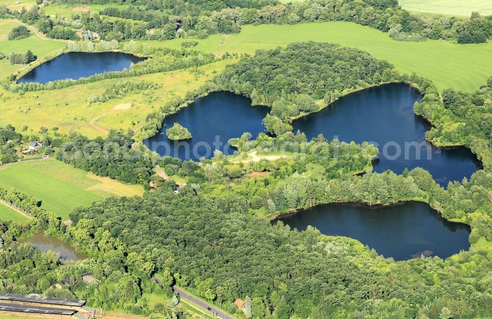 Herrenhof from above - Between Georgenthal and Herrenhof in Thuringia are three ponds, which are caused by flooded gravel pits. These habitats with excellent water quality are used as fishing ponds. In the foreground of the railway station of Georgenthal can be seen