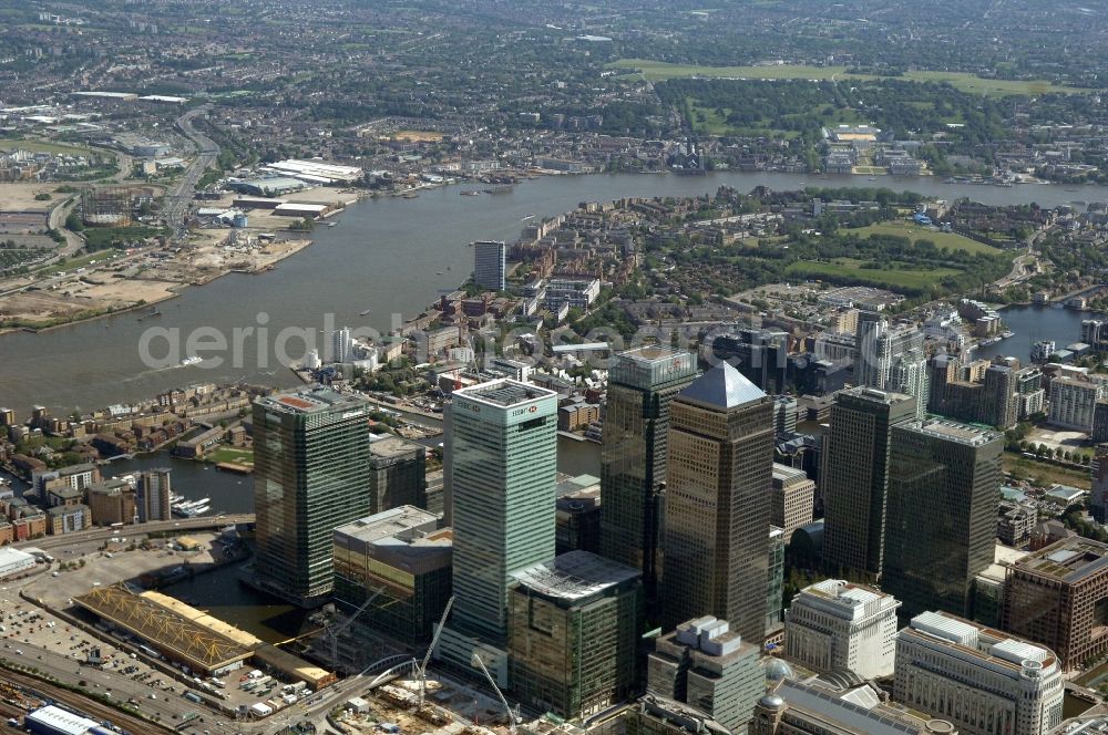 Aerial photograph Canary Wharf - Partial view of the complex of office buildings Canary Wharf in London. The complex is located on the Isle of Dogs in the borough of London Borough of Tower Hamlets in the heart of the Docklands, the former port area of London. From 1981 on, companies settled there. Today, the construction is used by companies, such as the financial institution HSBC and the media company The Daily Paragraph