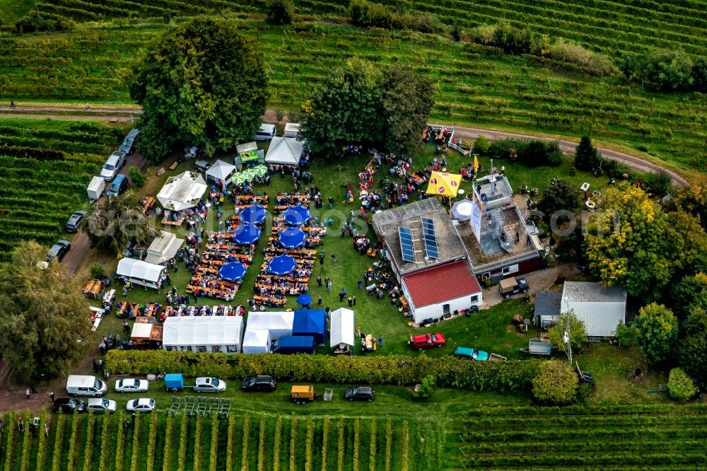 Ettenheim from the bird's eye view: Participants at the event area Heubergfest on Tag of deutschen Einheit in Ettenheim in the state Baden-Wurttemberg, Germany