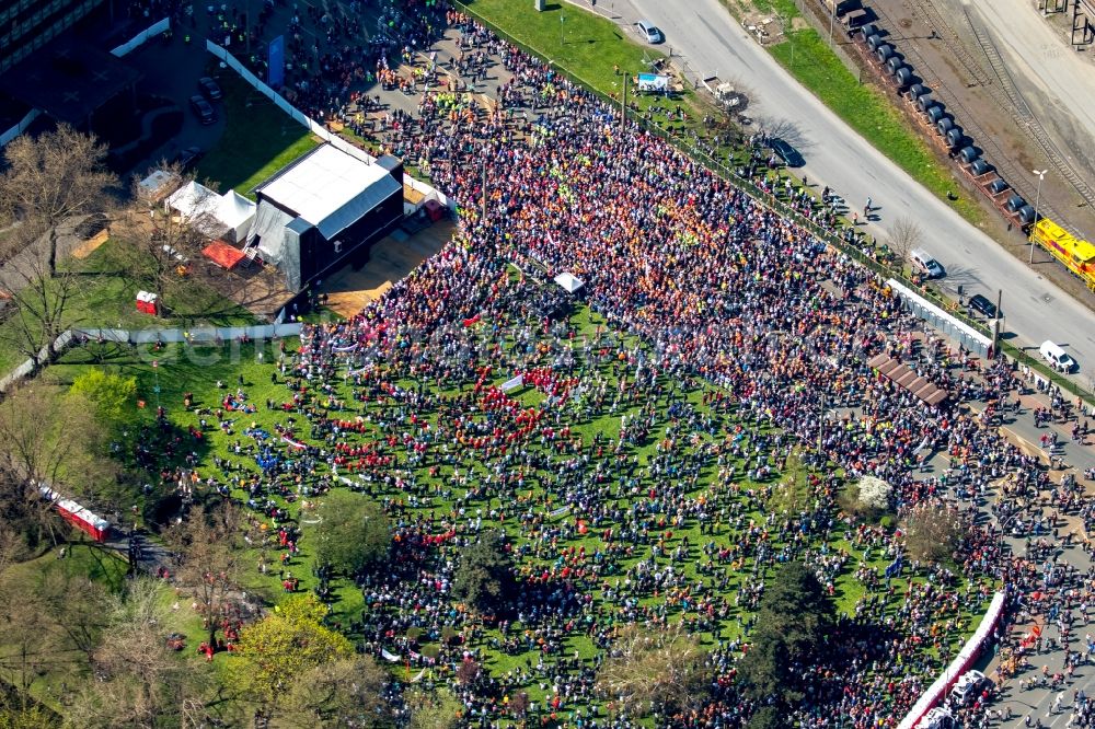 Duisburg from the bird's eye view: Participants in a demonstration for steel action of IG Metall in front of the Thyssen Krupp Steel headquarters in Duisburg - Bruck home in Duisburg in North Rhine -Westphalia