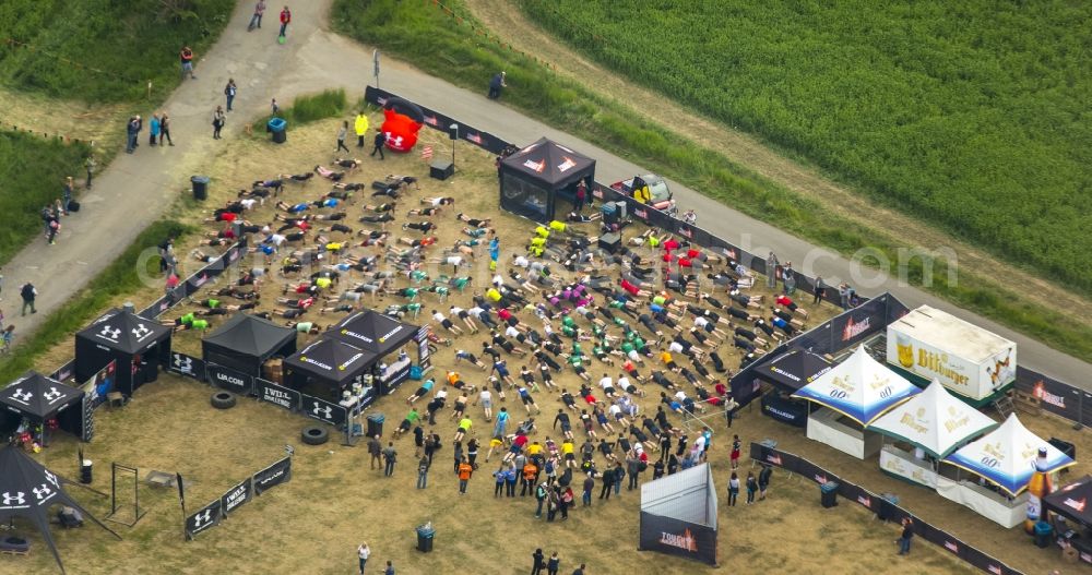 Aerial photograph Arnsberg - Participants of the sporting event Tough Mudder at the event area in Arnsberg in the state North Rhine-Westphalia
