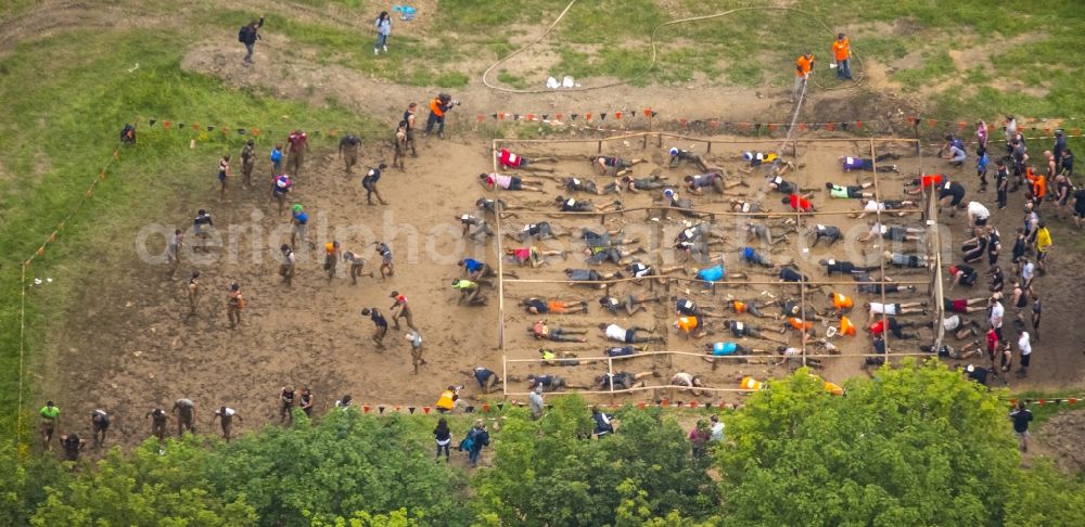 Arnsberg from the bird's eye view: Participants of the sporting event Tough Mudder at the event area in Arnsberg in the state North Rhine-Westphalia