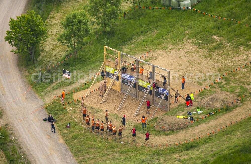 Arnsberg from the bird's eye view: Participants of the sporting event Tough Mudder at the event area in Arnsberg in the state North Rhine-Westphalia