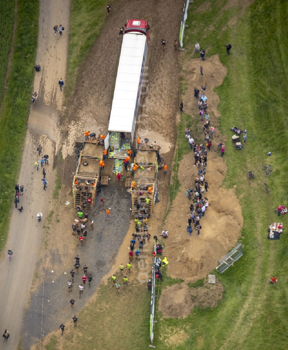 Aerial photograph Arnsberg - Participants of the sporting event Tough Mudder at the event area in Arnsberg in the state North Rhine-Westphalia