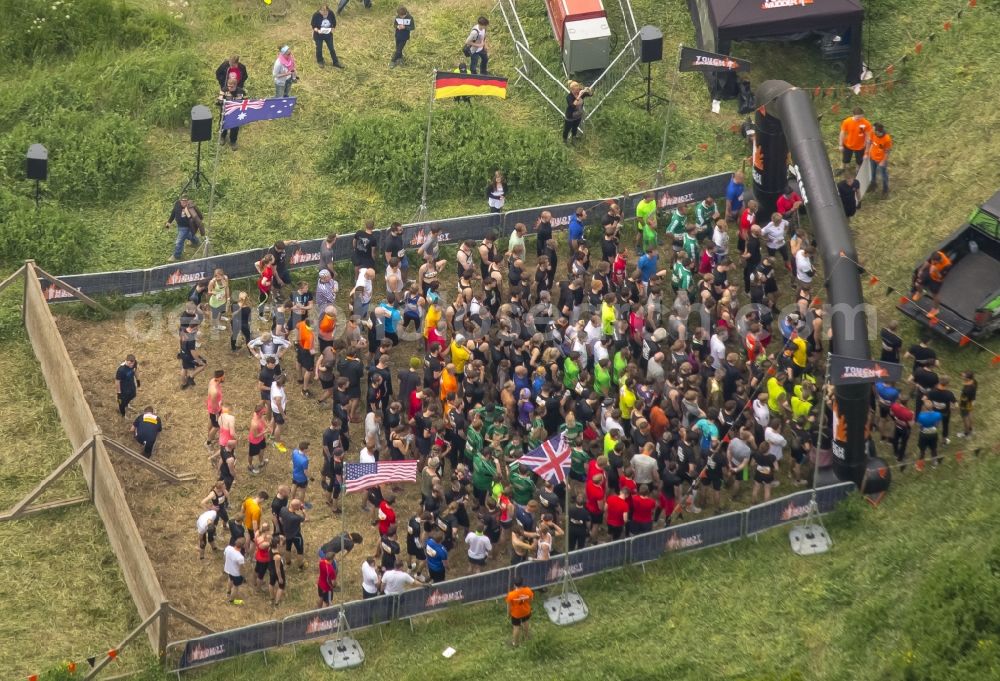 Arnsberg from the bird's eye view: Participants of the sporting event Tough Mudder at the event area in Arnsberg in the state North Rhine-Westphalia