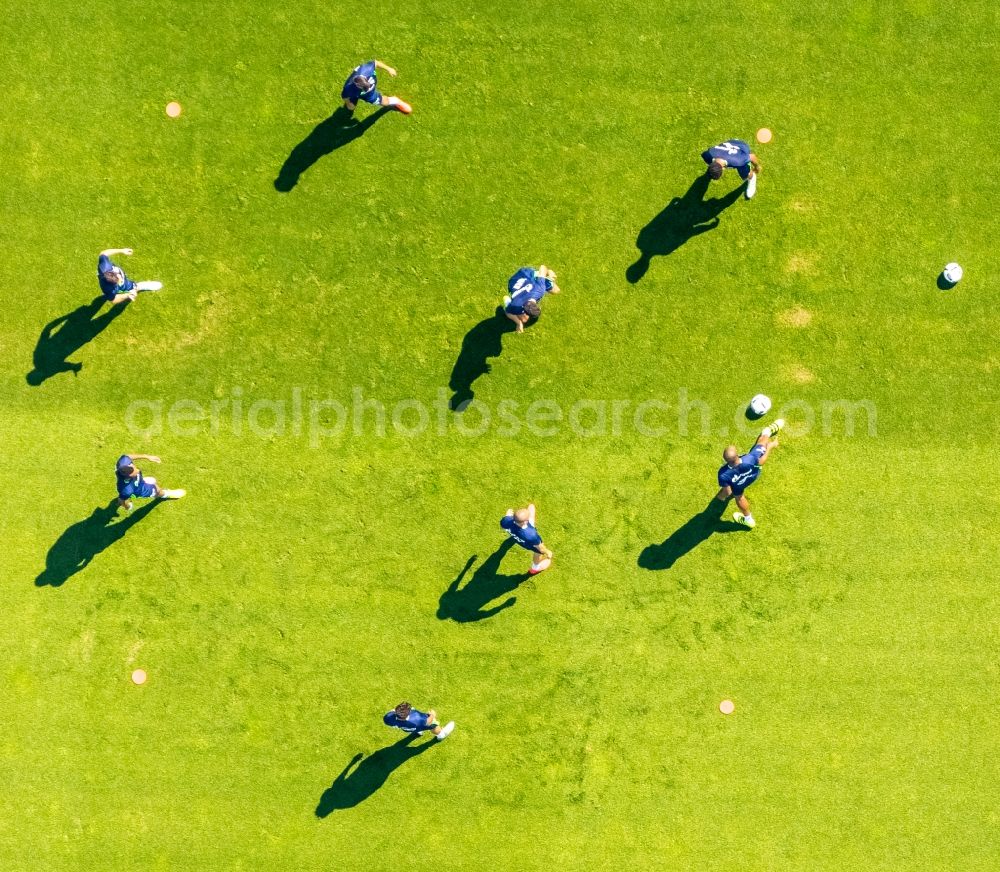 Aerial image Gelsenkirchen - Participants of the training on the sports grounds Bundesliga team S04 on the football training pitches at Charly's Schalke in Gelsenkirchen in North Rhine-Westphalia