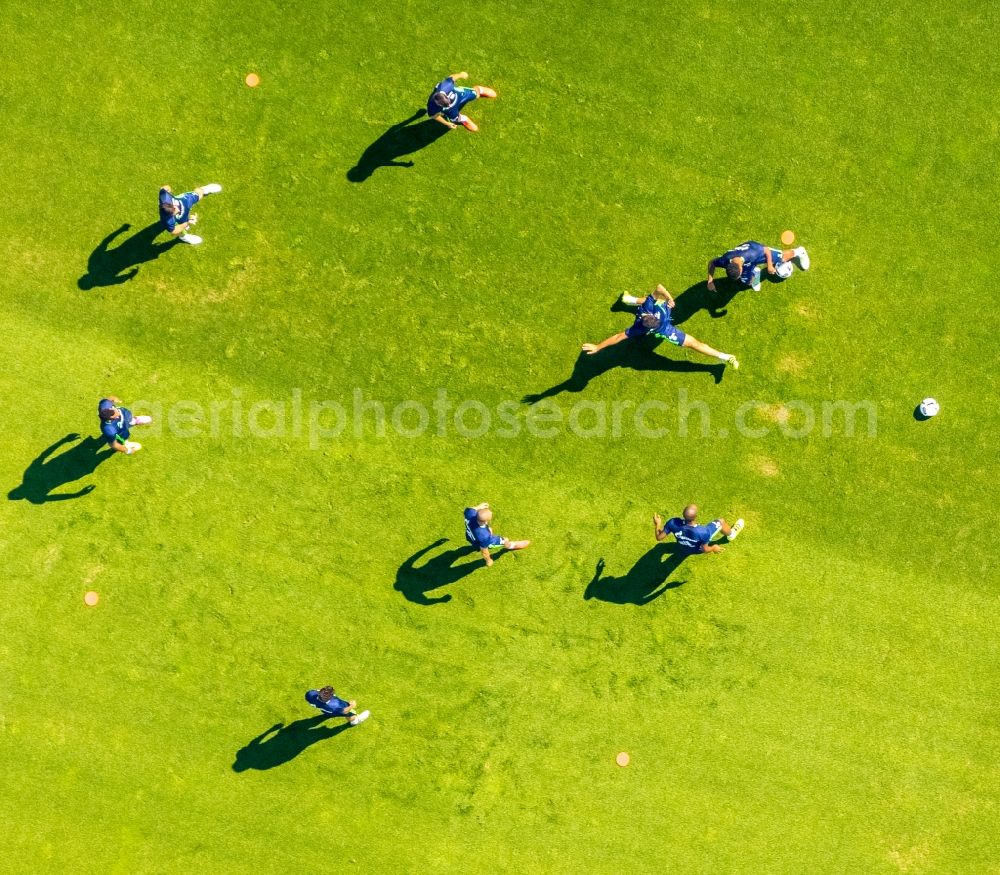 Gelsenkirchen from above - Participants of the training on the sports grounds Bundesliga team S04 on the football training pitches at Charly's Schalke in Gelsenkirchen in North Rhine-Westphalia