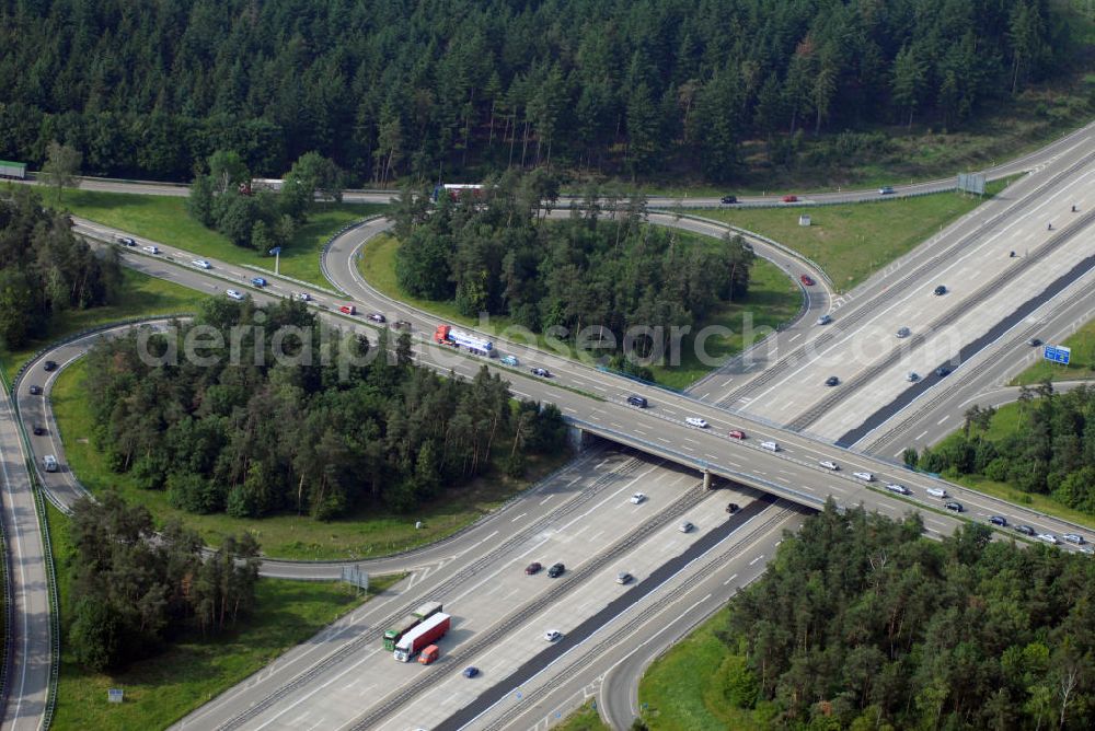 Aerial photograph Baden-Baden - Blick auf das Autobahnkreuz Baden-Baden. Die Kreuzung Baden-Baden ist Teil der A5 vom Hattenbacher Dreieck bis an die Grenze zur Schweiz. Auf 445 km Länge bestehen Verbindungen u.a. zum französischen Autobahnnetz (weiter bis Barcelona) und zur Verbindung Holland - Österreich. Als Teil der HaFraBa E.V. (Nord-Süd Verbindung) ist sie eine der meist befahrensten Strassen Europas. Das Kreuz Baden-Baden stellt die Verbindung von von der Staatsgrenze Frankreichs bis nach Bayern dar.