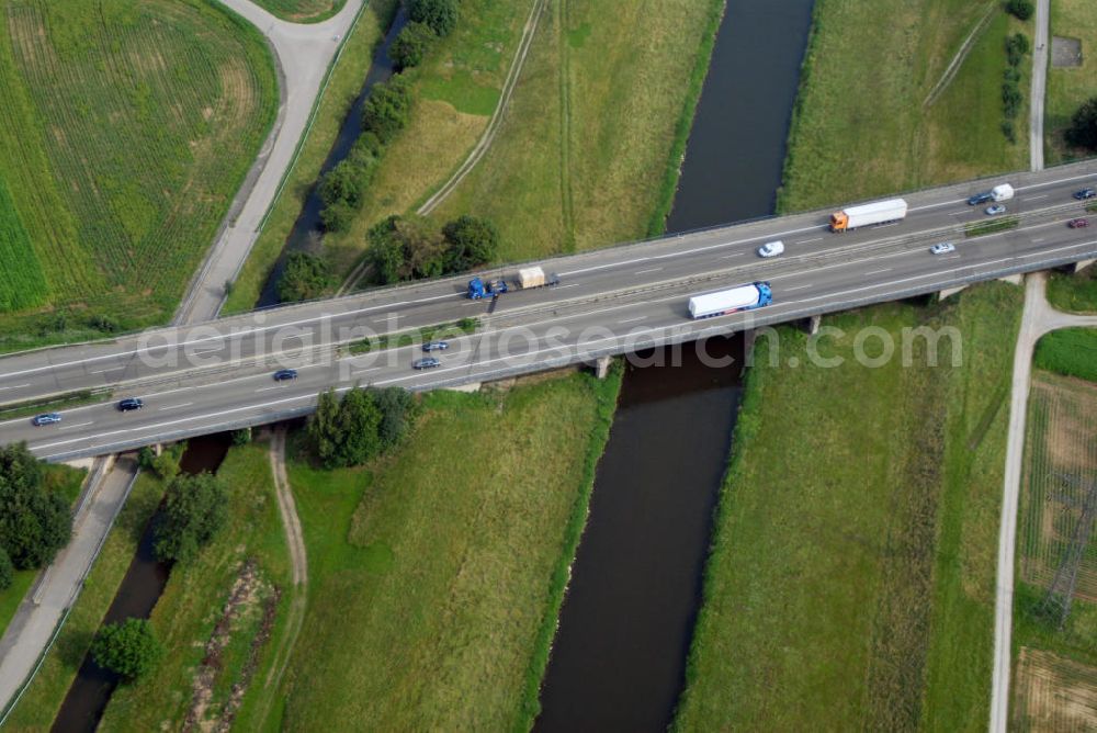 Aerial photograph Griesheim - Blick auf die A5 nahe Griesheim über die Kinzig. Die Kinzig ist ein deutscher Fluss, der den Schwarzwald und die Oberrheinische Tiefebene auf einer Länge von 95 km durchfließt. Die A5 ist Teil der HaFraBa (Hamburg Frankfurt Basel) vom Hattenbacher Dreieck bis an die Grenze zur Schweiz. Auf 445 km Länge bestehen Verbindungen u.a. zum französischen Autobahnnetz (bis Barcelona) und zur Verbindung Holland - Österreich. Als Teil der Nord-Süd Verbindung ist sie eine der meist befahrensten Strassen Europas.