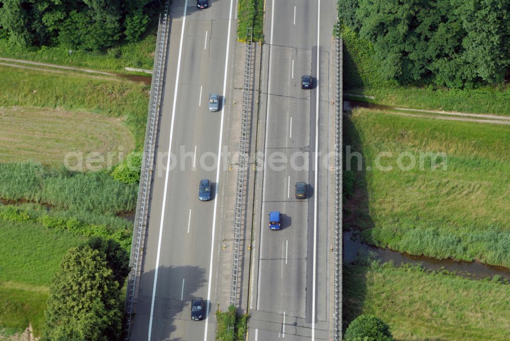 Aerial photograph Renchen - Blick auf die A5 nahe Renchen über die Rench. Die Rench ist ein rechter Nebenfluss des Rheins in der Ortenau (Mittelbaden). Sie entspringt am Kniebis bei Bad Griesbach im Schwarzwald und mündet nach 59 km bei Rheinau/Lichtenau/Helmlingen in den Rhein. Die A5 ist Teil der HaFraBa (Hamburg Frankfurt Basel) vom Hattenbacher Dreieck bis an die Grenze zur Schweiz. Auf 445 km Länge bestehen Verbindungen u.a. zum französischen Autobahnnetz (bis Barcelona) und zur Verbindung Holland - Österreich.