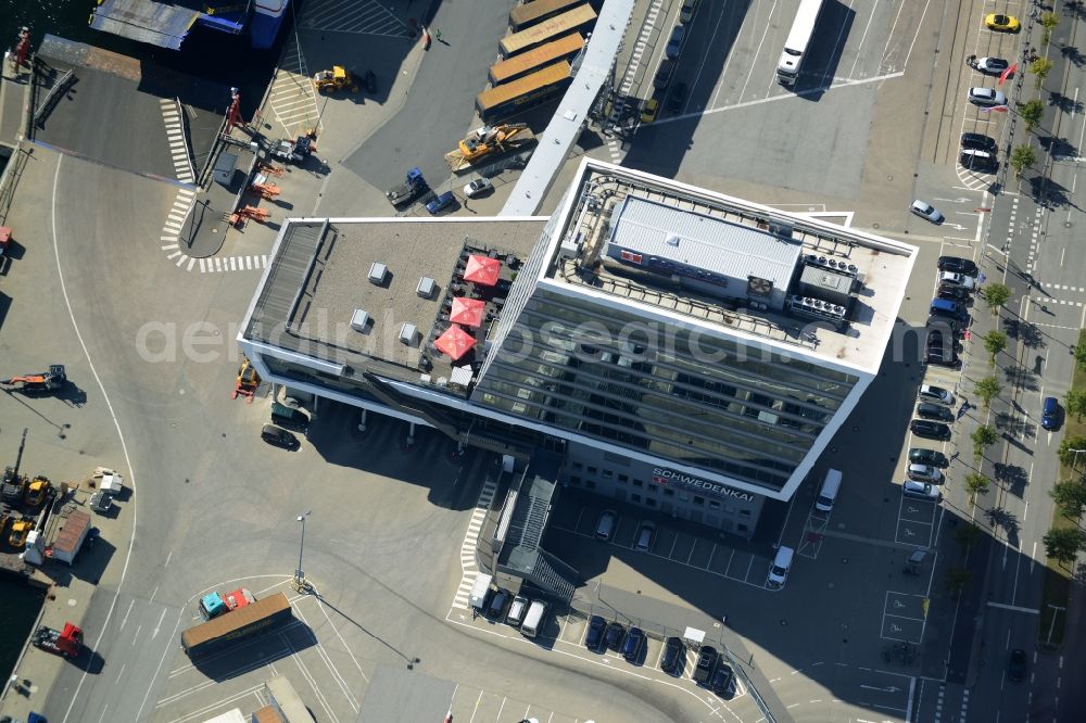 Aerial photograph Kiel - Terminal building on Schwedenkai in Kiel in the state of Schleswig-Holstein. The architectural distinct building was shaped after a ship and includes offices, a restaurant and a navy terminal