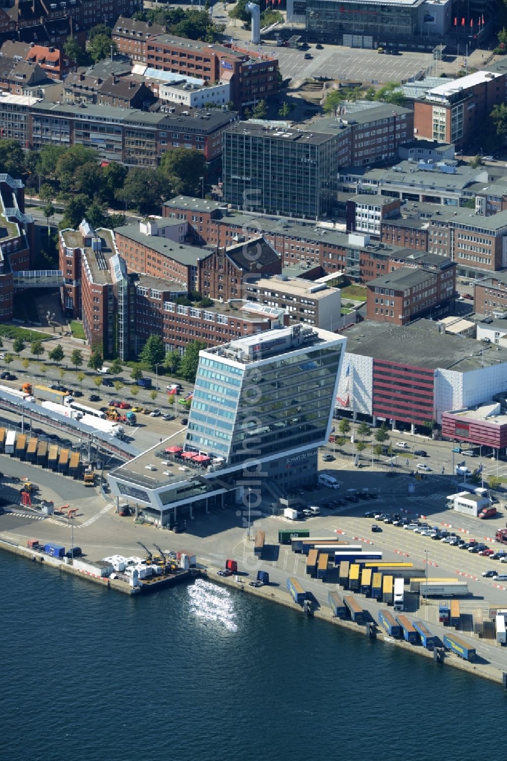 Kiel from above - Terminal building on Schwedenkai in Kiel in the state of Schleswig-Holstein. The architectural distinct building was shaped after a ship and includes offices, a restaurant and a navy terminal