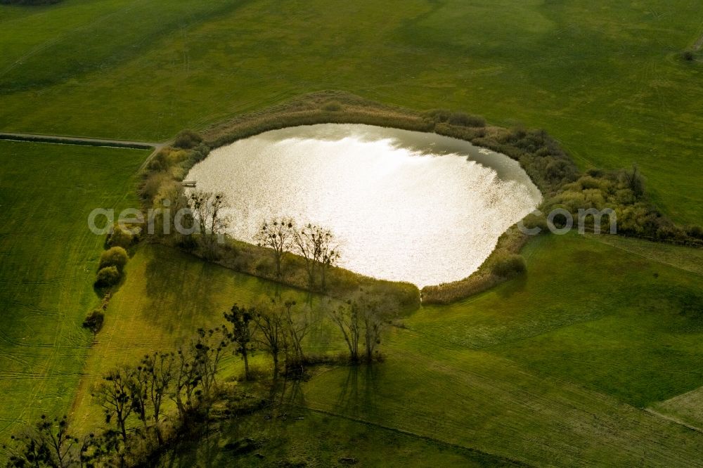 Aerial image Teterow - View of the Teschower Kuhle in the state Mecklenburg-Western Pomerania. The pond is located on a field in Teschow, a district of Teterow