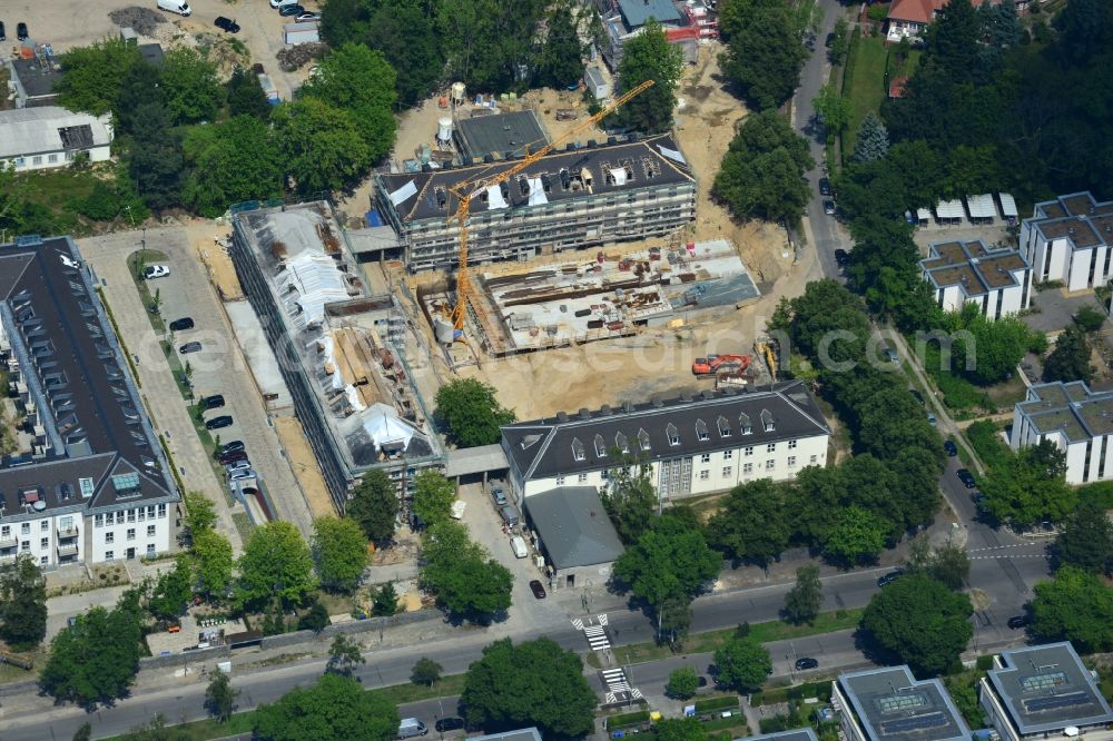 Aerial image Berlin - In the former headquarters of the U.S. forces in the district of Dahlem in Berlin is currently being created, the real estate site The metropolitan gardens. Quality apartments and suites in the former barracks and administrative buildings integrated from the Terraplan estate and fiduciary mbH at the corner Clayallee Saagemunder road 