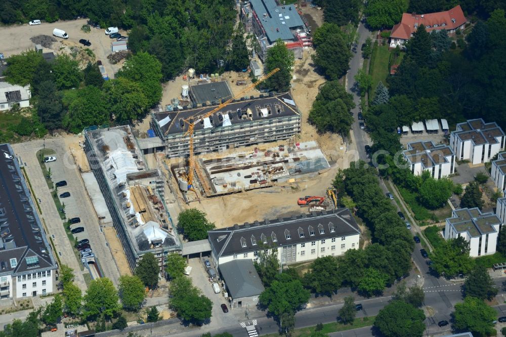 Aerial photograph Berlin - In the former headquarters of the U.S. forces in the district of Dahlem in Berlin is currently being created, the real estate site The metropolitan gardens. Quality apartments and suites in the former barracks and administrative buildings integrated from the Terraplan estate and fiduciary mbH at the corner Clayallee Saagemunder road 